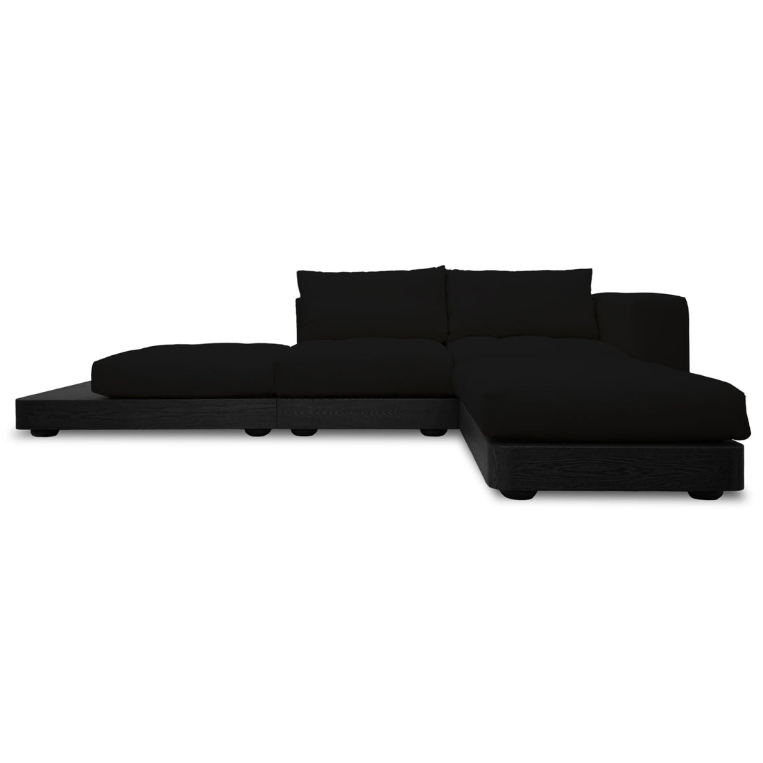 Le canapé coin droit Essence | Onyx de Humble Nature présente un design minimaliste avec des coussins bas et larges pour plus de confort et une structure modulaire dans un style sectionnel noir artisanal.