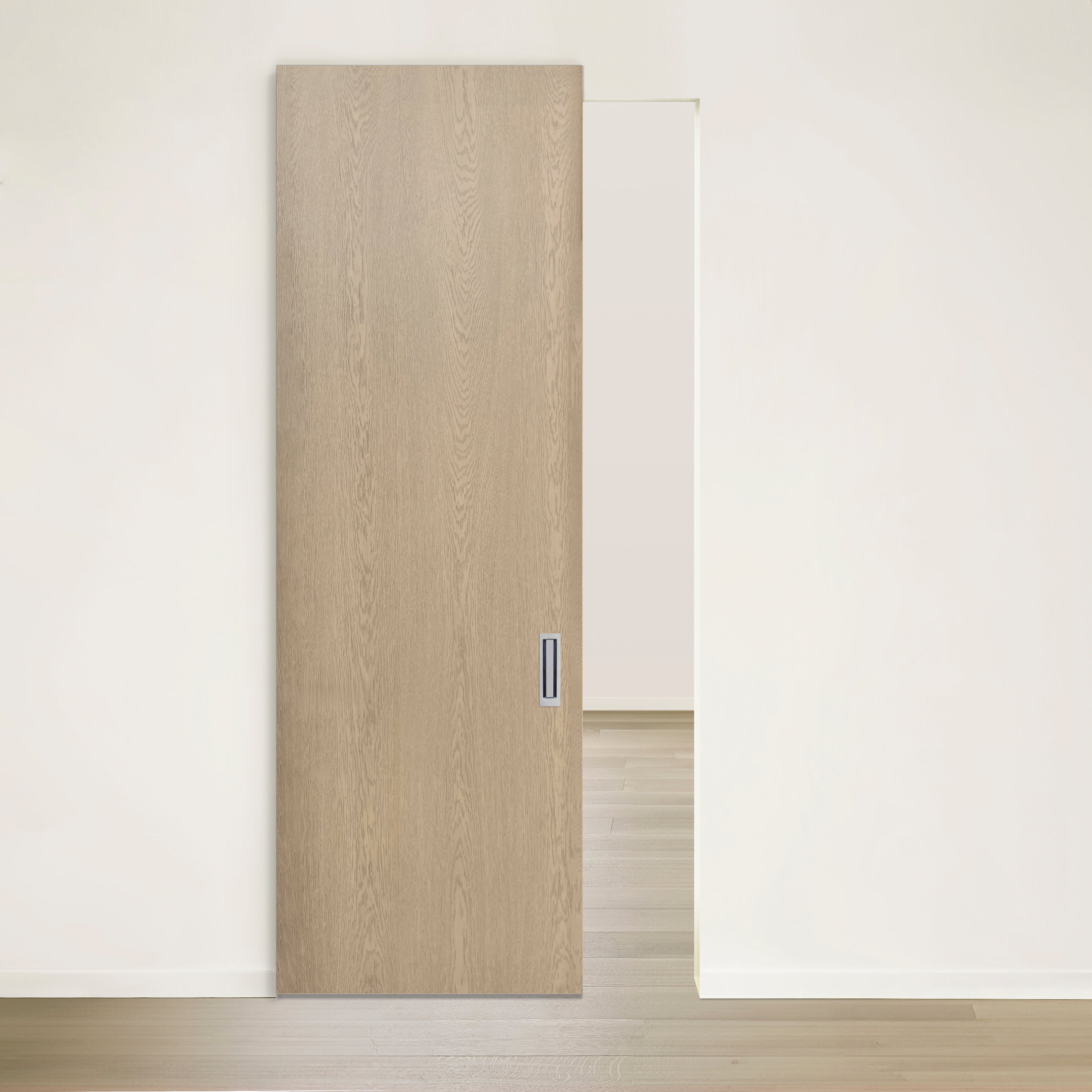 Une Porte Pure coulissante en chêne rouge placage brossé sur dosse Authentik de Humble Nature souvre partiellement sur une pièce minimaliste avec un parquet en bois clair et des murs blancs unis, offrant un aperçu dun espace de style similaire. Le design moderne est conforme aux normes de certification TSCA Title VI.